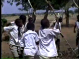  Miswaki Primary School children beat millet and sing an unidentified song