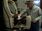 David Straubinger shop tour: machine used in measuring pad thickness for testing