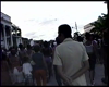 Procession moves up Avenida René Ramón Latour, singing Lucumí songs